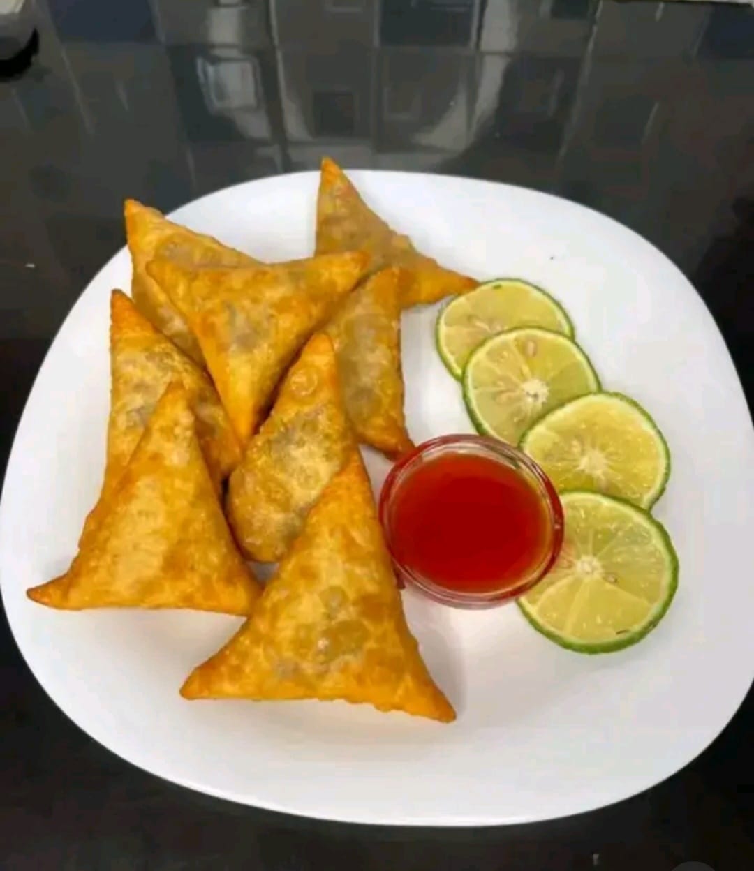 Samosa with sweet syrup